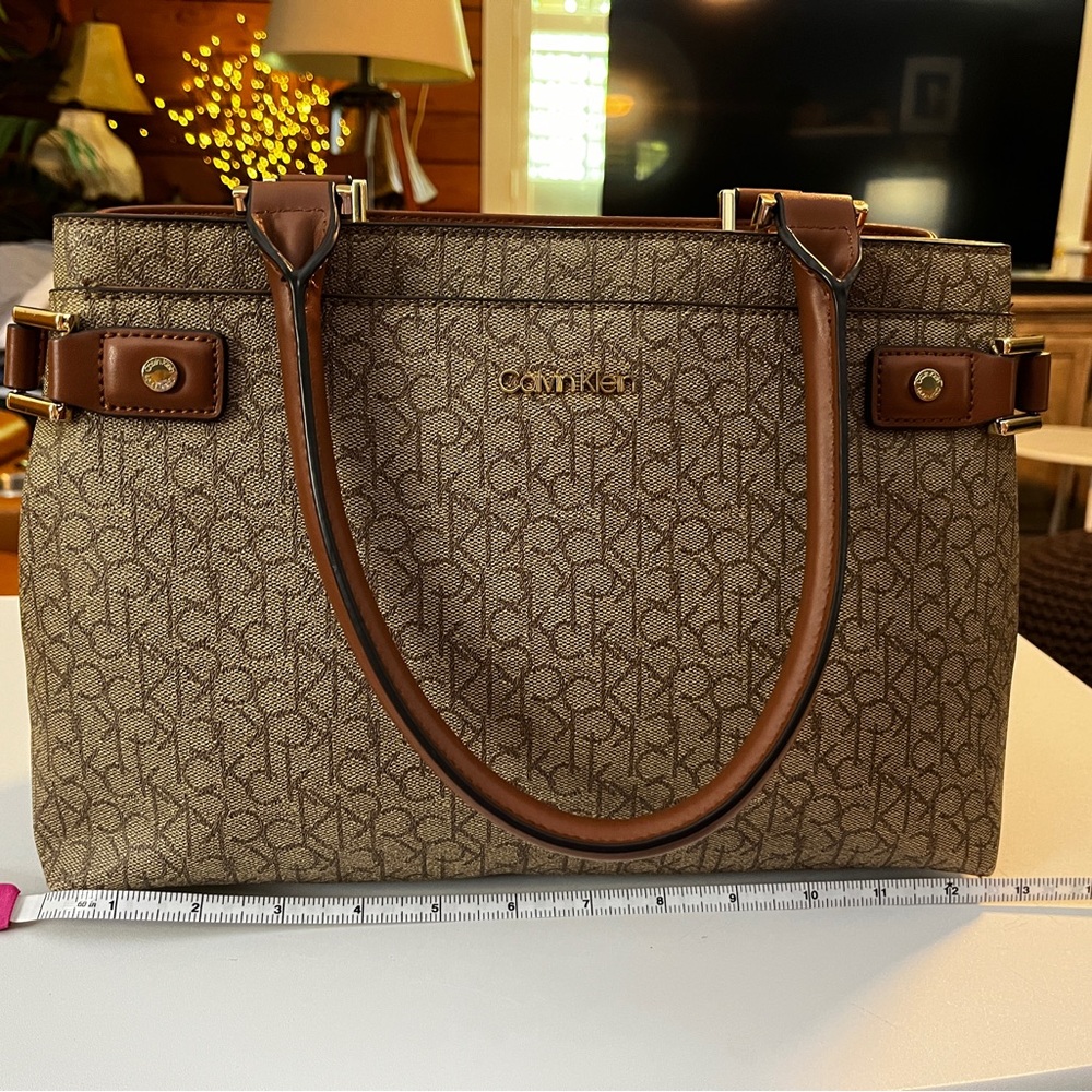 Calvin Klein Brown Monogram Satchel with Tan Trim 13” x 9” x 6”.